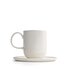 The photo shows a white porcelain coffee mug with saucer. It holds 330 ml and features the SONNENTOR letters..